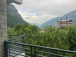 a balcony with a view of a mountain at MK Resort in Palchān