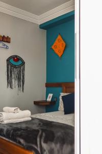a bedroom with a bed and a blue wall at Blue Rina Hostel in Agadir +288 photos
