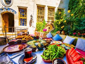 a table with many plates of food on it at Sedirli Konak 1751 Special Class in Ürgüp