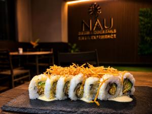 a sushi dish sitting on top of a table at Nau Guest House & Restaurant in Iquitos