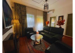 a living room with a couch and a table at Retreat Cameroon BASTOS in Yaoundé