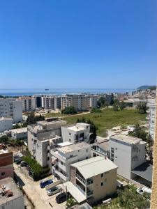an aerial view of a city with buildings at Apartman Raba in Šušanj