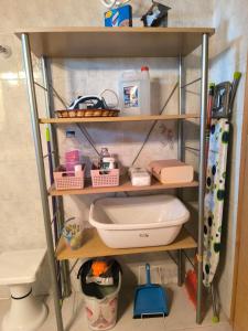 a shelf with a sink and other items in a bathroom at Afroditi Country Residence in Oropos +17 photos