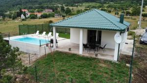 a villa with a pool and a house at Vila Lana in Trebinje