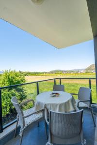 a table and chairs on a balcony with a view at Luna in Dalaman