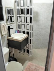 a bathroom with a sink and a shower at departamento bugambilias in Tepic