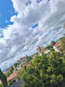 a group of buildings in a city under a cloudy sky at Faymu Homes in Kitengela 