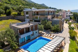 an aerial view of a house with a swimming pool at Apart & Spa Beganovic in Dobra Voda