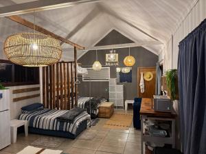 a bedroom with two beds in a tent at Blue Lagoon 4x4 Cottage in Umngazana