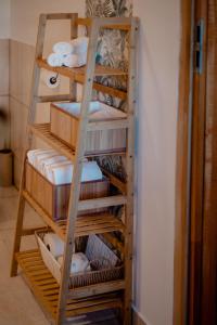 a stack of towels on a shelf in a room at Nad Andruszkowianką in Andruszkowice +33 photos