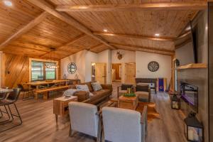 a living room with a couch and a table at Deer Valley in Elk Park