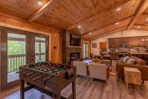 a living room with a foos ball on a table at Deer Valley in Elk Park