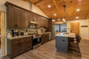 a large kitchen with wooden cabinets and a counter top at Deer Valley in Elk Park
