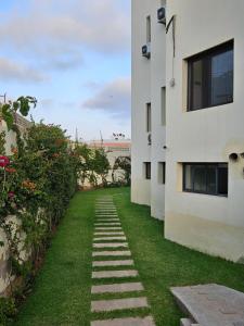 a walkway in the yard of a building at Ocean Rooftop Hotel in Ben Slimane