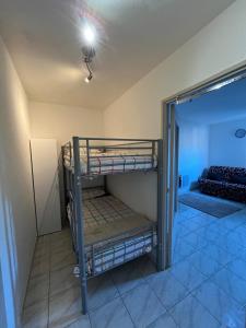 a room with two bunk beds in a room at Studio avec piscine à 1km de la plage in Cavalaire-sur-Mer +13 photos
