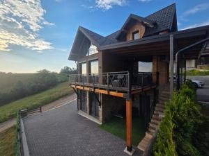 an image of a house with a deck at LUX PINE house in Zlatibor