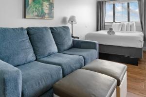 a living room with a couch and a bed at The Palace 2306 in Myrtle Beach