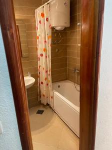 a bathroom with a tub and a toilet and a sink at Apartmani Minna Alim in Utjeha +56 photos