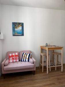 a living room with a couch and a table at Échappée Méditerranéenne in Lectoure