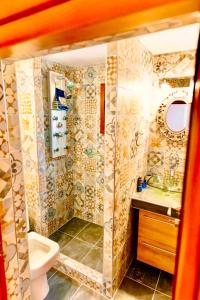 a bathroom with a shower with a toilet and a sink at VillaAnna in Keratea +46 photos