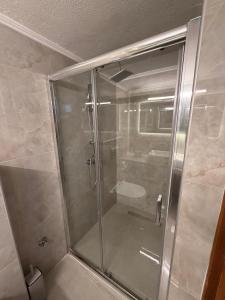 a shower with a glass door in a bathroom at Casa al mare Anastasia in Nea Kallikrateia +20 photos