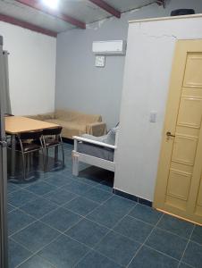 a room with a room with a bed and a table at La Tranquila in Fernández +1 photo