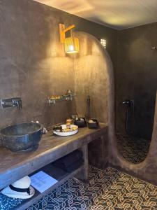 a bathroom with a sink and a large mirror at Ellie Villa Seaside Koufonisi in Nisída Koufonísion +45 photos