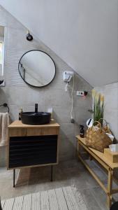 a bathroom with a black sink and a mirror at Nebeska Terasa in Knić +18 photos
