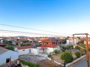 an overhead view of a city with buildings at Alexandros House in Néa Tríglia