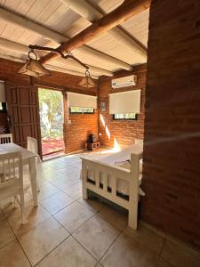 a living room with a table and a dining room at Casita siempre verde in Los Hornillos