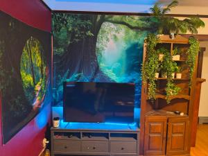 a large fish tank in a room with a wall at Briugu's Bunkhouse in Denver