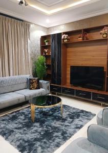 a living room with a couch and a coffee table at The Crest at Oyarifa in Oyarifa