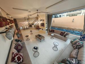 an aerial view of a living room with a couch at Al Salateen Villas Resort in Al ‘Ammārīyah
