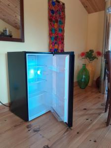 a refrigerator sitting on the floor in a room at Spa Stukely in Eastman