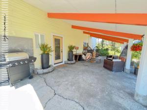 a patio of a house with a stove at Tide Pool Cabin, a Soquinomere Private Hotel on the Dunes, Downtown Ocean Shores in Ocean Shores