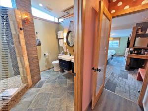 a bathroom with a shower and a toilet and a sink at Tide Pool Cabin, a Soquinomere Private Hotel on the Dunes, Downtown Ocean Shores in Ocean Shores +52 photos