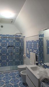 a bathroom with a toilet and a sink and a shower at Casa Emi in Amalfi