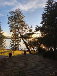 a set of stairs with a view of a lake at Apart Hotel La Busqueda in Moquehue