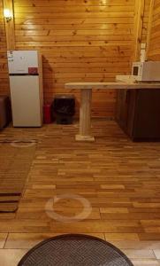 a room with a table and a refrigerator at كوخ بحانز الأول in Taif +2 photos