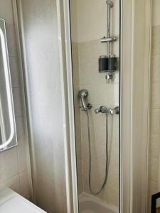 a shower with a shower head in a bathroom at Le cocon Panoramique in Tours +17 photos
