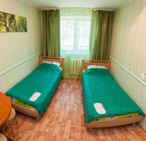 Ліжко або ліжка в номері Apartment Sevastopolskaya 17