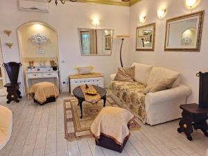 a living room with a couch and a table at DolceMorfeo in Olbia +17 photos