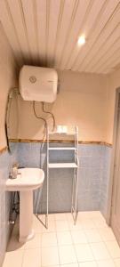 a small bathroom with a sink and a toilet at La Casa Beduina Hostel in Riyadh