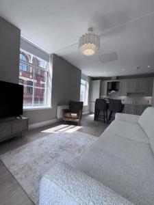 a living room with a couch and a tv at Studio 4 in Portadown