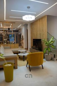 a living room with a couch and a table at Villa BOCANIA in Cotonou