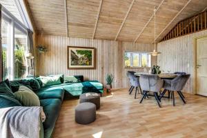 a living room with a green couch and a table at C11248-Hemmet-Ildervej-26 in Hemmet +33 photos