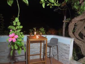 a table and chairs on a patio at night at Casa Emi in Amalfi