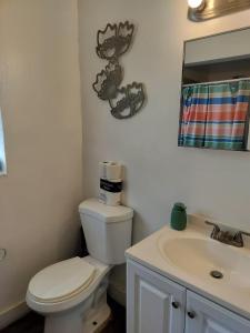 a bathroom with a white toilet and a sink at Beautiful and Equipped Studio H in Hollywood +13 photos