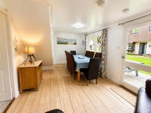 a dining room with a table and chairs at 47 Trevithick Court in Hayle