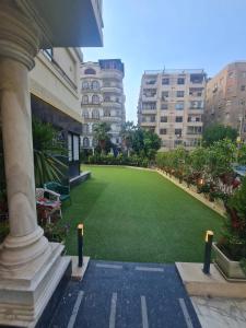 a large lawn in the middle of a building at Boutique Hotel El Mesaadia in Cairo